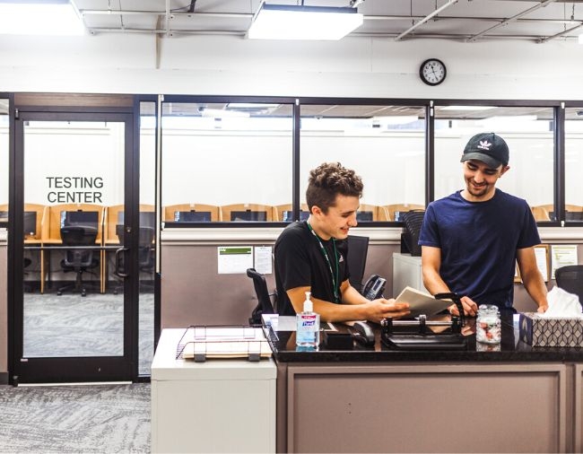 Tutors talking at testing center