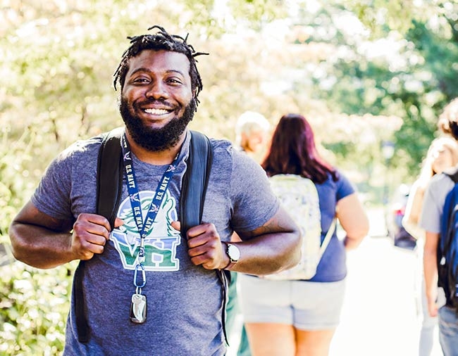 Veteran Walking Outside on campus