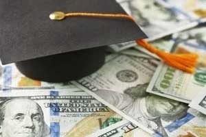 graduation cap amidst cash