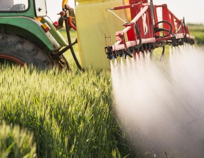 Tractor watering crops