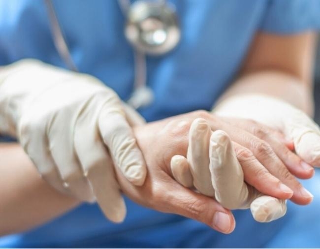 Nurse holding hand