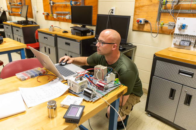 Electrical Mechatronics Student Working at a Laptop Computer