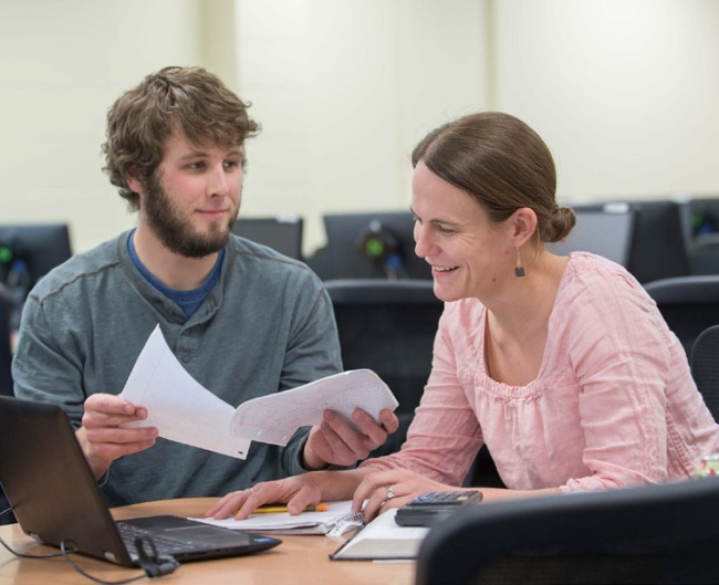 Two students working together at a computer